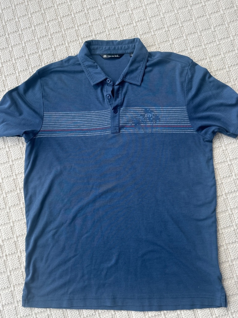 Travis Mathew Navy Blue Short-Sleeve Polo with Subtle Chest Stripes